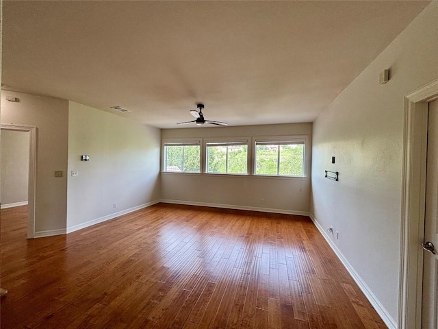 1733 Canonero Dr, Austin, TX 78746 - empty room featuring a ceiling fan and wood-type flooring