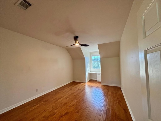 1733 Canonero Dr, Austin, TX 78746 - additional living space featuring wood finished floors, a ceiling fan, and vaulted ceiling