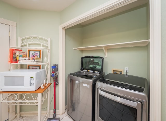 5102 Coppermead Ln, Austin, TX 78754 - washroom with washer and clothes dryer and tile patterned floors