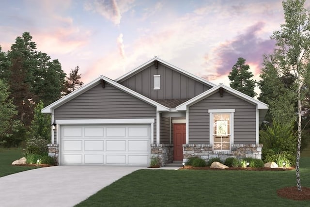 6500 Smarty Jones Ln, Buda, TX 78610 - view of front facade with board and batten siding, concrete driveway, an attached garage, a yard, and stone siding