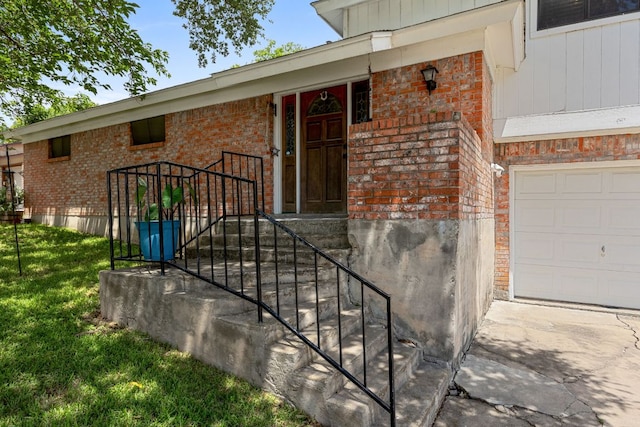 706 Cambridge Dr, Round Rock, TX 78664 - property entrance featuring brick siding, a lawn, and an attached garage