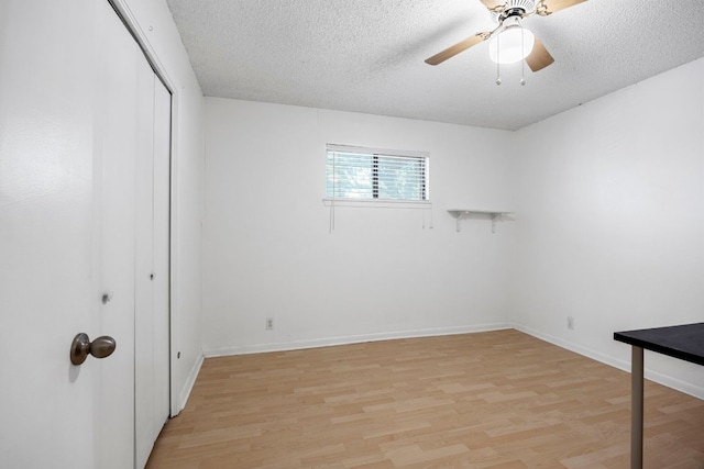 706 Cambridge Dr, Round Rock, TX 78664 - unfurnished bedroom with light wood-type flooring, a closet, a textured ceiling, and a ceiling fan