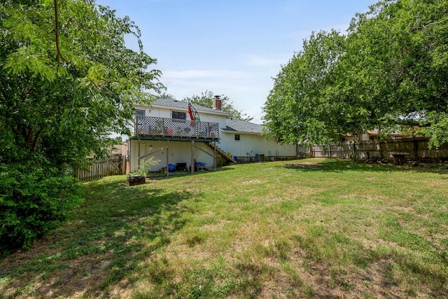 706 Cambridge Dr, Round Rock, TX 78664 - fenced backyard featuring stairs and a wooden deck