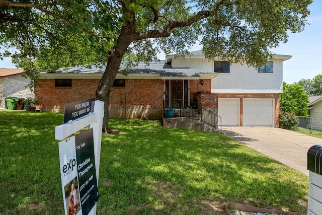 706 Cambridge Dr, Round Rock, TX 78664 - split level home featuring a garage, brick siding, and concrete driveway