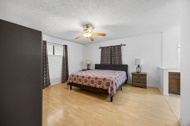 706 Cambridge Dr, Round Rock, TX 78664 - bedroom featuring light wood-type flooring, a textured ceiling, and ceiling fan