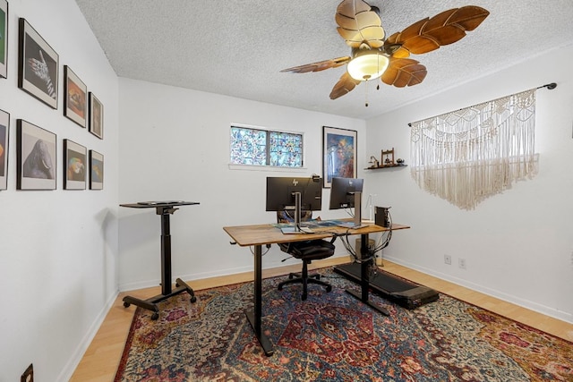 706 Cambridge Dr, Round Rock, TX 78664 - office with wood finished floors, a textured ceiling, and a ceiling fan