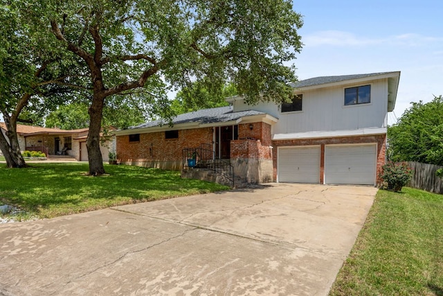 706 Cambridge Dr, Round Rock, TX 78664 - split level home featuring brick siding, a garage, and driveway