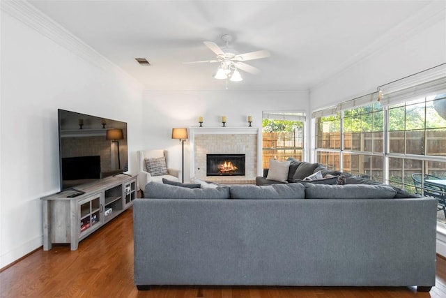 6100 Open Range Trl, Austin, TX 78749 - living area with a brick fireplace, crown molding, a ceiling fan, and wood finished floors