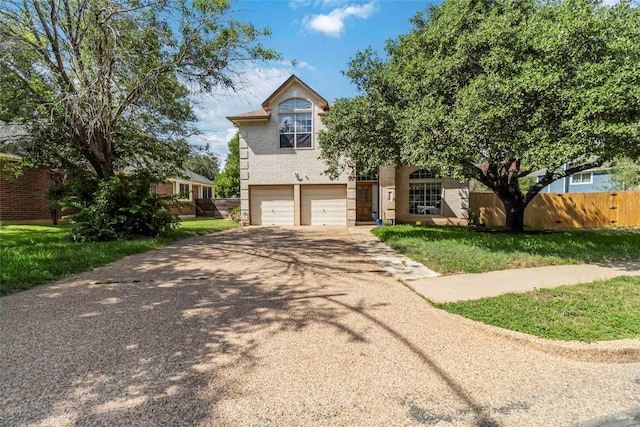 6100 Open Range Trl, Austin, TX 78749 - view of front facade featuring driveway, an attached garage, and stucco siding