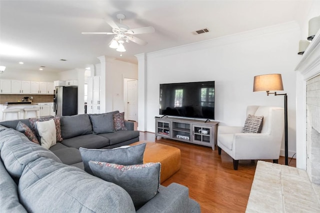 6100 Open Range Trl, Austin, TX 78749 - living area with a ceiling fan, ornamental molding, and wood finished floors