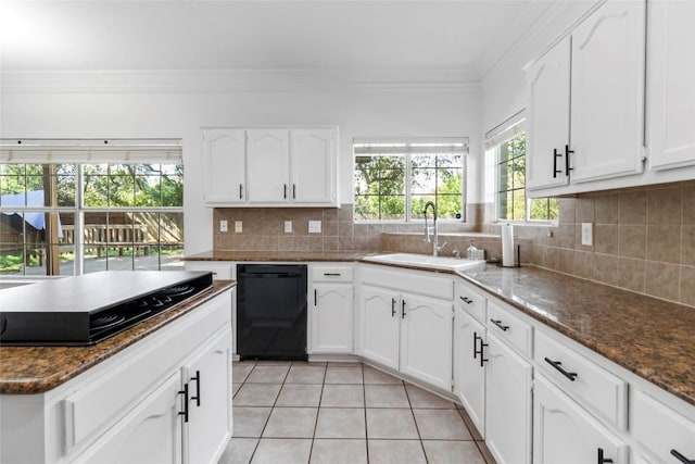 6100 Open Range Trl, Austin, TX 78749 - kitchen featuring black appliances, light tile patterned flooring, crown molding, backsplash, and white cabinets