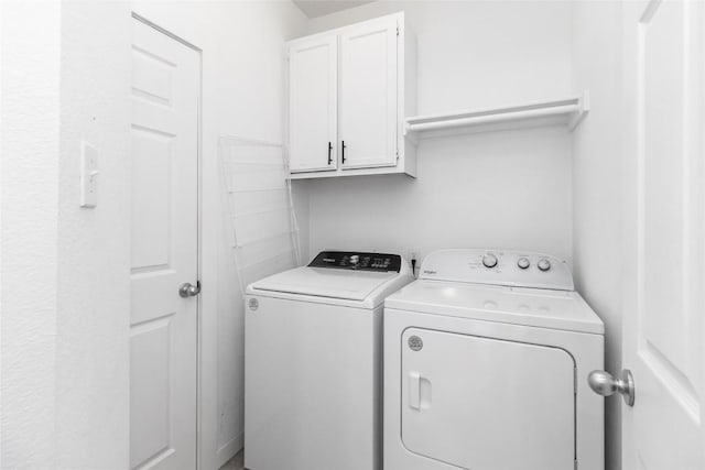 6100 Open Range Trl, Austin, TX 78749 - washroom with washing machine and clothes dryer and cabinet space