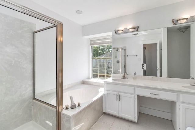 6100 Open Range Trl, Austin, TX 78749 - bathroom with a garden tub, double vanity, a stall shower, and tile patterned floors