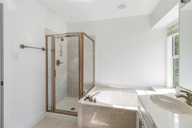 6100 Open Range Trl, Austin, TX 78749 - full bath featuring vanity, a shower stall, a garden tub, and tile patterned flooring