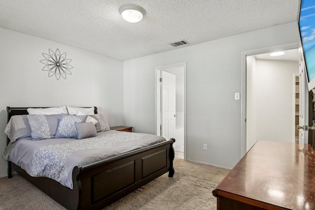 2101 Barnett Dr, Cedar Park, TX 78613 - bedroom featuring light carpet and a textured ceiling