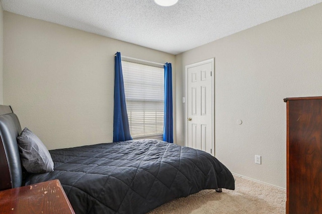 2101 Barnett Dr, Cedar Park, TX 78613 - carpeted bedroom featuring a textured ceiling and baseboards