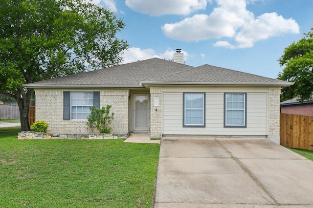 2101 Barnett Dr, Cedar Park, TX 78613 - view of front of home featuring a chimney, brick siding, and concrete driveway