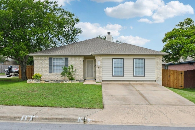 2101 Barnett Dr, Cedar Park, TX 78613 - view of front of property with a chimney, brick siding, and driveway