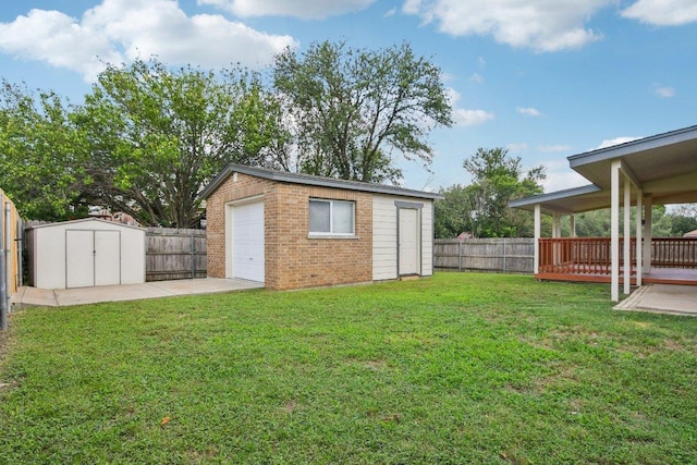 2101 Barnett Dr, Cedar Park, TX 78613 - fenced backyard featuring a shed, a wooden deck, and a garage