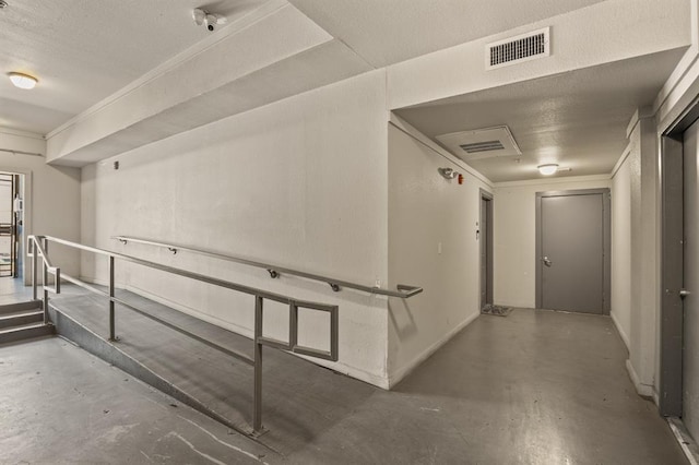 2502 Leon St Unit 102, Austin, TX 78705 - hallway with concrete flooring and a textured ceiling