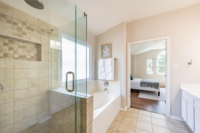 8716 Corran Ferry Dr, Austin, TX 78749 - ensuite bathroom with a stall shower, lofted ceiling, a bath, tile patterned flooring, and vanity