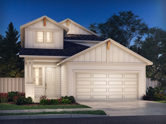 716 Sun Grove Trl, Georgetown, TX 78628 - view of front of home featuring roof with shingles, board and batten siding, a garage, and driveway