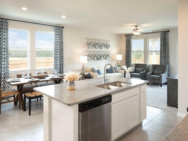 716 Sun Grove Trl, Georgetown, TX 78628 - kitchen featuring dishwasher, open floor plan, light tile patterned flooring, light stone counters, and recessed lighting