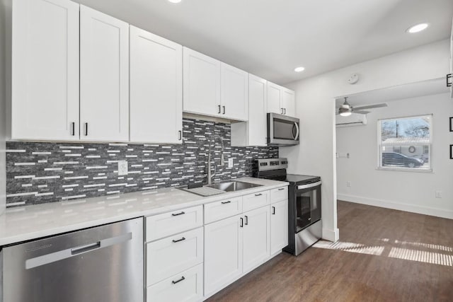 304 Harris St, Smithville, TX 78957 - kitchen with appliances with stainless steel finishes, ceiling fan, light countertops, tasteful backsplash, and recessed lighting