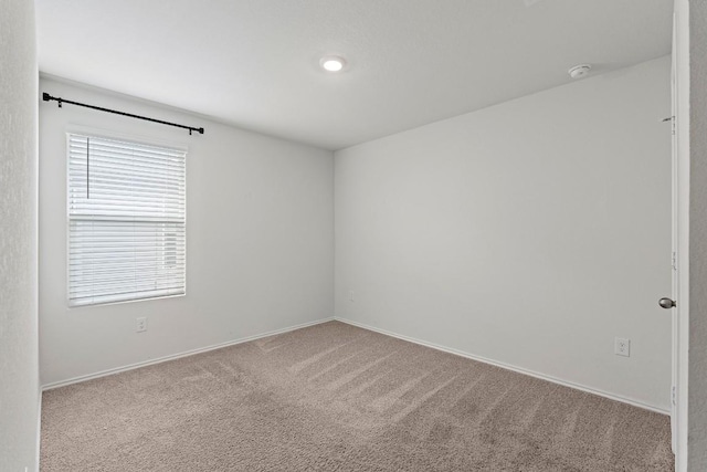 11817 Rush Ln, Elgin, TX 78621 - empty room featuring carpet and a smoke detector