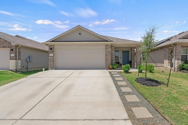 11817 Rush Ln, Elgin, TX 78621 - single story home with brick siding, an attached garage, driveway, and a front yard
