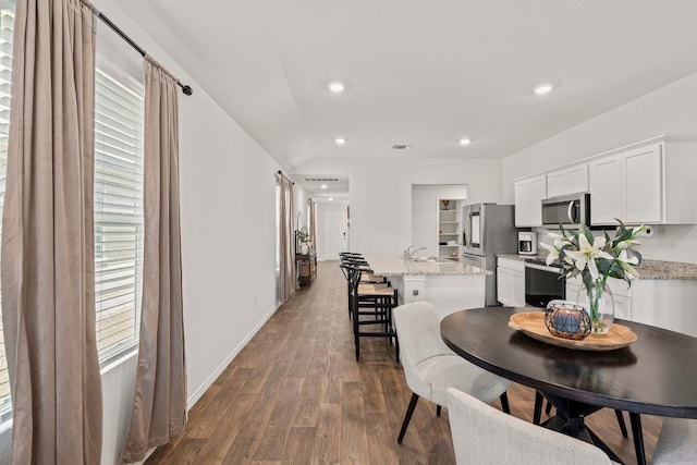 11817 Rush Ln, Elgin, TX 78621 - dining space with dark wood-style floors, healthy amount of natural light, and recessed lighting