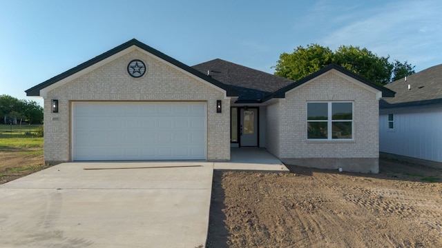 2115 Blackhawk Loop, Belton, TX 76513 - ranch-style home with brick siding, driveway, and a garage