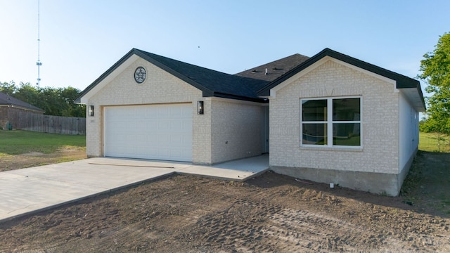 2115 Blackhawk Loop, Belton, TX 76513 - ranch-style house featuring brick siding, an attached garage, and driveway