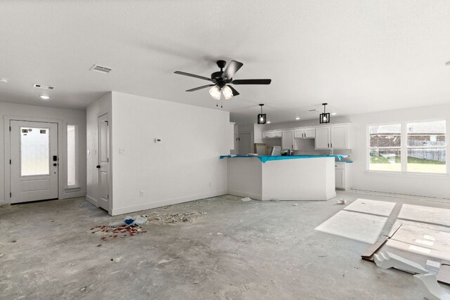 2115 Blackhawk Loop, Belton, TX 76513 - unfurnished living room featuring ceiling fan and unfinished concrete flooring