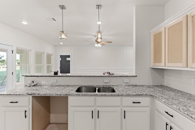 2119 Blackhawk Loop, Belton, TX 76513 - kitchen with ceiling fan, hanging light fixtures, light stone countertops, white cabinets, and recessed lighting