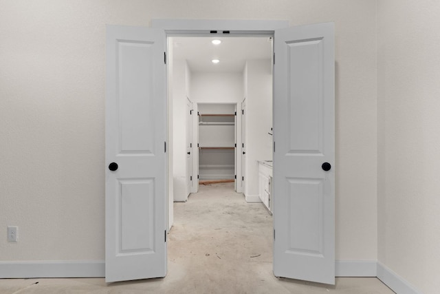 2119 Blackhawk Loop, Belton, TX 76513 - hallway with unfinished concrete flooring and baseboards