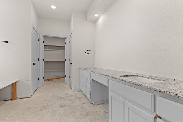 2119 Blackhawk Loop, Belton, TX 76513 - bathroom featuring double vanity, unfinished concrete flooring, a walk in closet, and recessed lighting