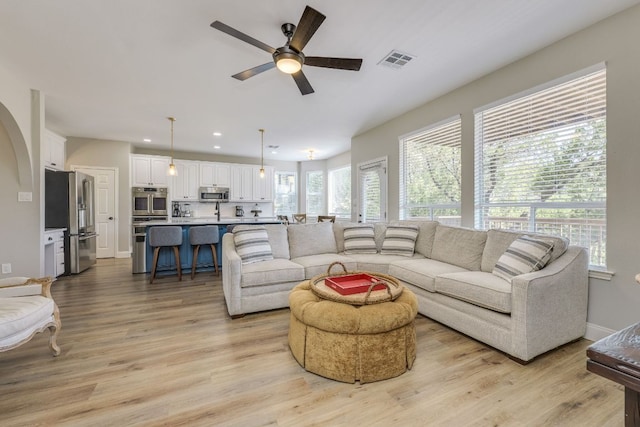 704 Deckhouse Dr, Lago Vista, TX 78645 - living room featuring ceiling fan, recessed lighting, and light wood-style flooring