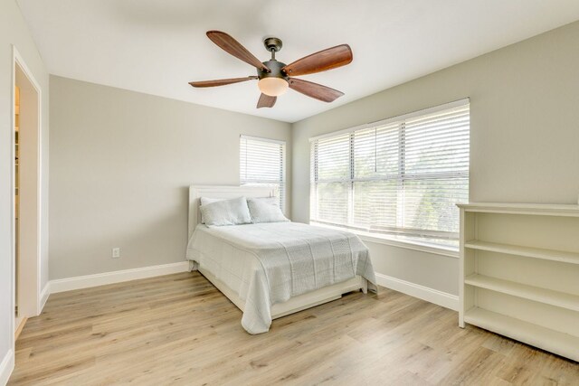 704 Deckhouse Dr, Lago Vista, TX 78645 - bedroom with wood finished floors and ceiling fan