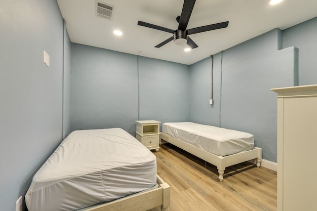 704 Deckhouse Dr, Lago Vista, TX 78645 - bedroom with light wood finished floors, recessed lighting, and a ceiling fan