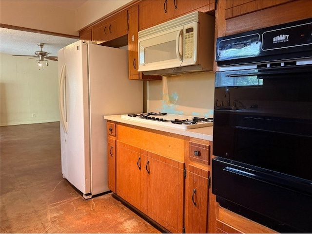 11601 Oak Trl, Austin, TX 78753 - kitchen featuring white appliances, a warming drawer, a ceiling fan, brown cabinets, and light countertops