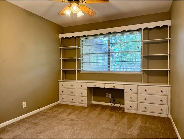 11601 Oak Trl, Austin, TX 78753 - unfurnished office featuring a ceiling fan, carpet flooring, and built in desk