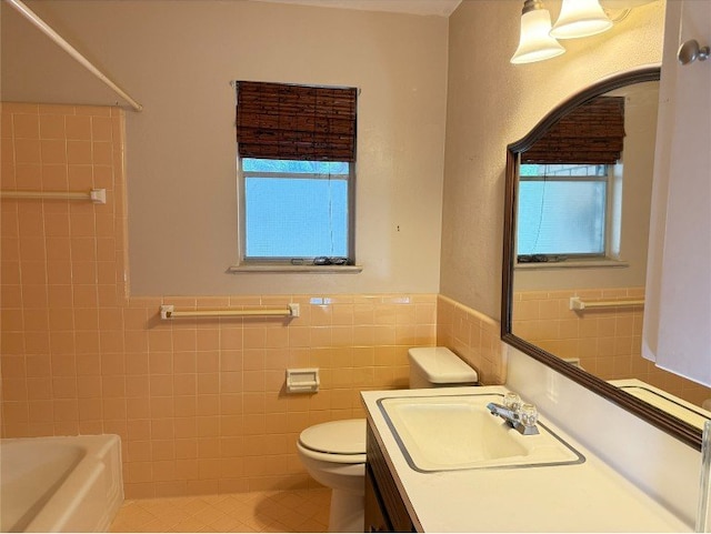 11601 Oak Trl, Austin, TX 78753 - bathroom with tile walls, tile patterned flooring, healthy amount of natural light, vanity, and wainscoting