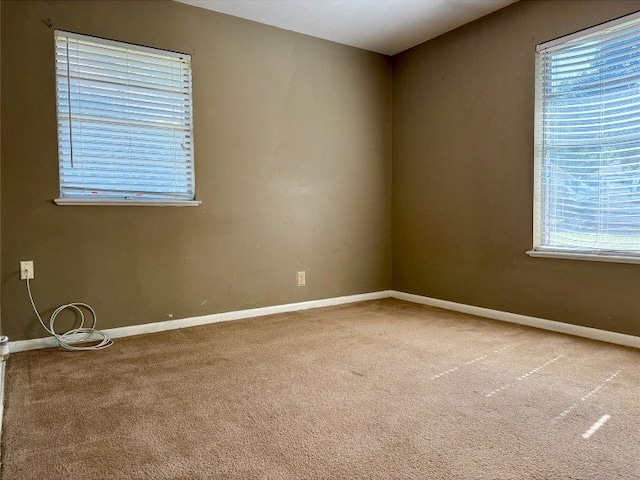 11601 Oak Trl, Austin, TX 78753 - spare room featuring carpet flooring and baseboards