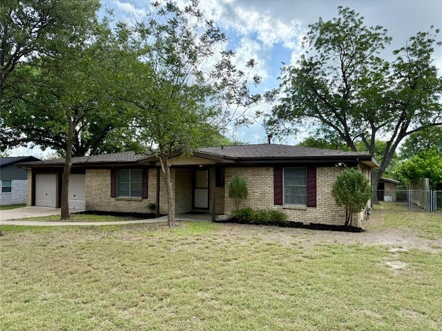 11601 Oak Trl, Austin, TX 78753 - ranch-style home with an attached garage, concrete driveway, and brick siding