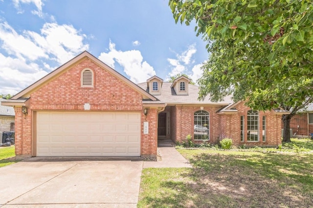 800 Mountain Ridge Dr, Leander, TX 78641 - traditional-style home with brick siding, concrete driveway, and an attached garage