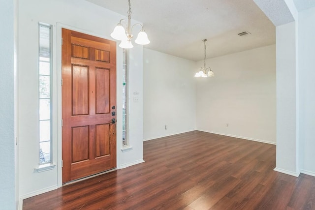 800 Mountain Ridge Dr, Leander, TX 78641 - entryway with a chandelier, dark wood-style floors, and plenty of natural light