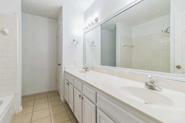 800 Mountain Ridge Dr, Leander, TX 78641 - full bath featuring double vanity, tile patterned floors, shower / washtub combination, and a textured ceiling