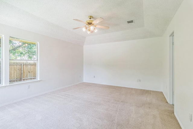 800 Mountain Ridge Dr, Leander, TX 78641 - unfurnished room with light carpet, a textured ceiling, and a ceiling fan