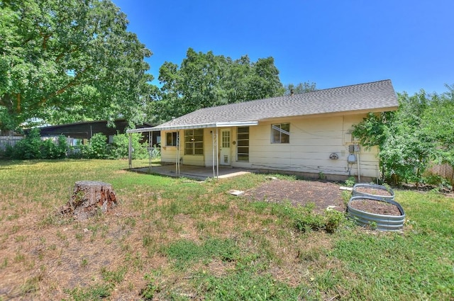 803 Easy Day Cv, Austin, TX 78745 - back of house with a patio area and a lawn